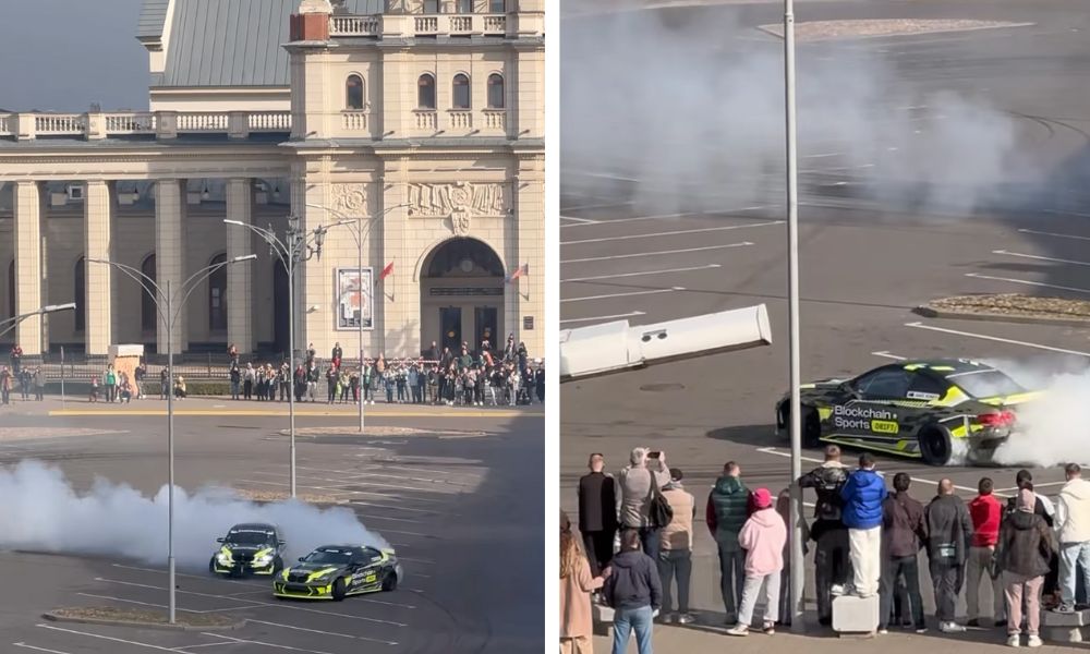 Скриншот видео в Instagram с дрифтующими автомобилями на парковке у железнодорожного вокзала.